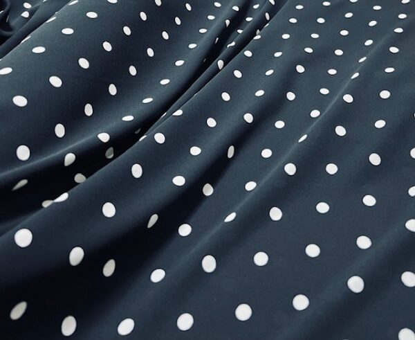 P111 - 100% Polyester  - Georgette  - Black with Small White Spots - 150cm wide - $18.00 per mtr