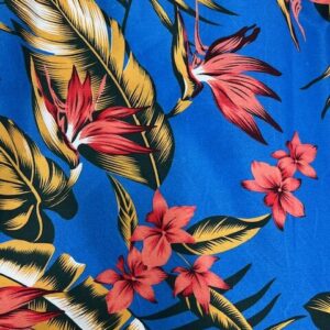 IP49 - Island Prints - Bird of Paradise flowers in Apricot with Gold leaves on Royal Blue - 1.15cm wide - 65% Polyester / 35% Cotton - $8.00 pm - Special $5.00 per mtr