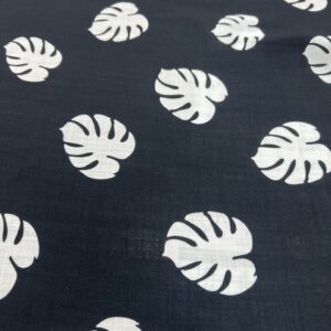 LC36 - Linen Blend - 6cm White Rubber Tree Leaves on Black Background - 55% Linen / 45% Cotton - 150cm wide - $26.00 per mtr