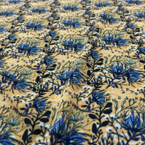 P222 - 100% Polyester - Georgette - Mustard Yellow with an array of Navy Blue and White Flowers - 145cm wide - $20.00 per mtr