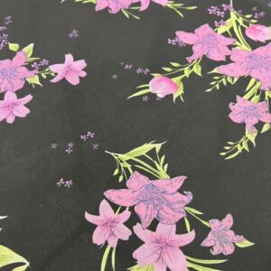 P231 - Georgette - 100% Polyester - Black with Large Purple / Pink Lillies- 150cm wide - $16.00 per mtr