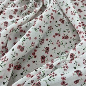 P259 - 100% Polyester -Georgette - White with small clusters of Peach Flowers - 150cm wide - $16.00 per mtr