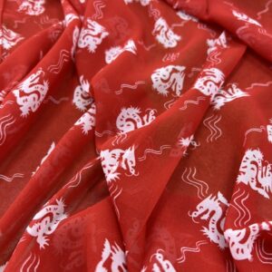 P261 - 100% Polyester -Georgette - White Dragons on Red - 150cm wide - $20.00 per mtr