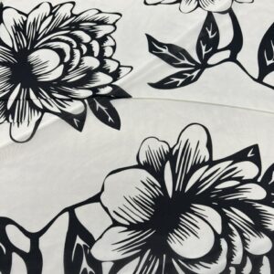 P281 - 100% Polyester - Chiffon - Off White / Creamy Colour with Extremely large Black Silhouette Flowers - 150cm wide - $28.00 per mtr