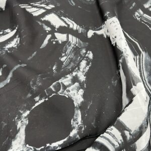 P297 - 100% Polyester - Chiffon - Black with Swirls of White - 150cm wide - $18.00 per Mtr