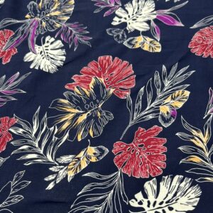 R126 - 100% Rayon - Large Leaves in Various Colors of Rose Red, White and Lemon in Silhouettes on Navy Background - 145cm wide - $20.00 per mtr